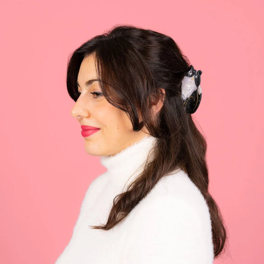 Pince à cheveux noir et blanc