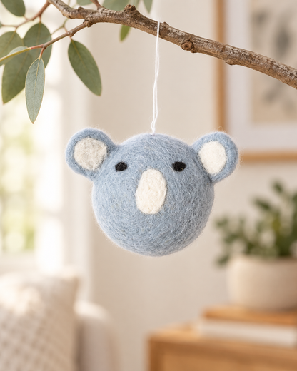 Koala Aveva en laine suspendu à une branche, mise en situation reconstituée par IA