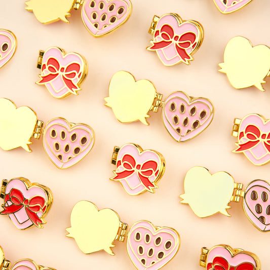 Pin's Boîte de chocolat Coucou Suzette en émail